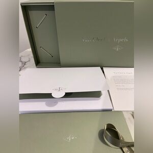 Van Cleef & Arpels Elegant Green and White Packaging